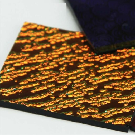 Colorful dichroic glass scraps used in a jewelry making project.