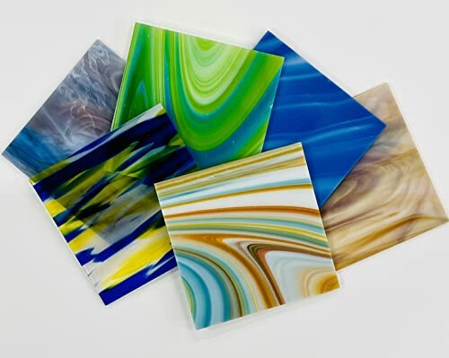 Colorful abstract art tiles arranged in a scattered pattern.