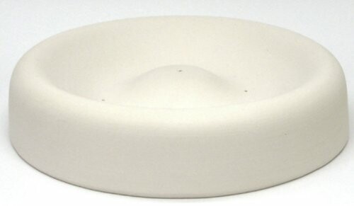 Modern circular white sofa with minimalistic design.