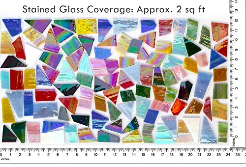 Assorted stained glass mosaic pieces with ruler for scale.
