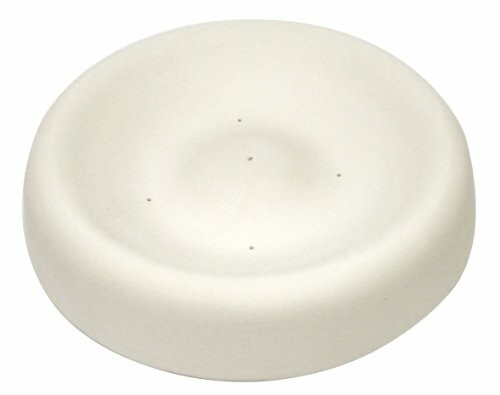 Simple white ceramic soap dish with a circular shape.