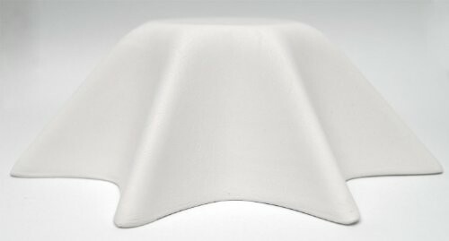 A white cloth draped over a mysterious object.